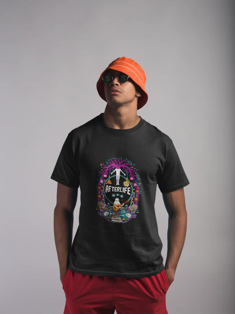 Young man wearing a black graphic print T-shirt with a circular design reading 'Afterlife' surrounded by a colorful floral pattern, paired with red shorts, an orange bucket hat, and sunglasses, standing against a plain white background.