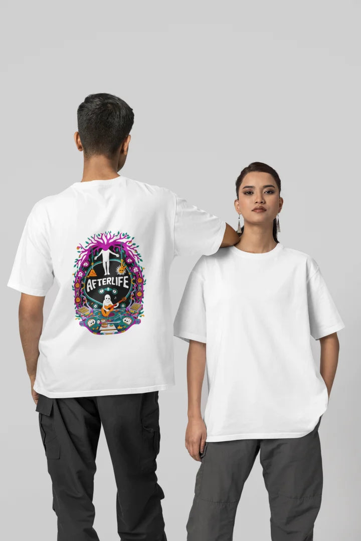 Man and woman standing side by side, both wearing white oversized tee shirts with a colorful psychedelic Afterlife graphic design featuring a circular pattern with pink and purple flowers. The design includes an illustration of a person with arms outstretched, surrounded by vibrant colors, set against a plain white background.