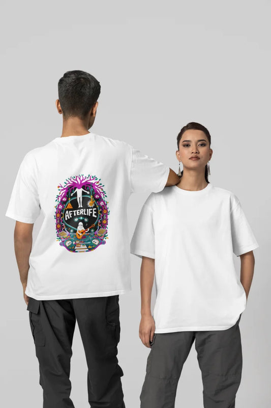 Man and woman standing side by side, both wearing white oversized tee shirts with a colorful psychedelic Afterlife graphic design featuring a circular pattern with pink and purple flowers. The design includes an illustration of a person with arms outstretched, surrounded by vibrant colors, set against a plain white background.