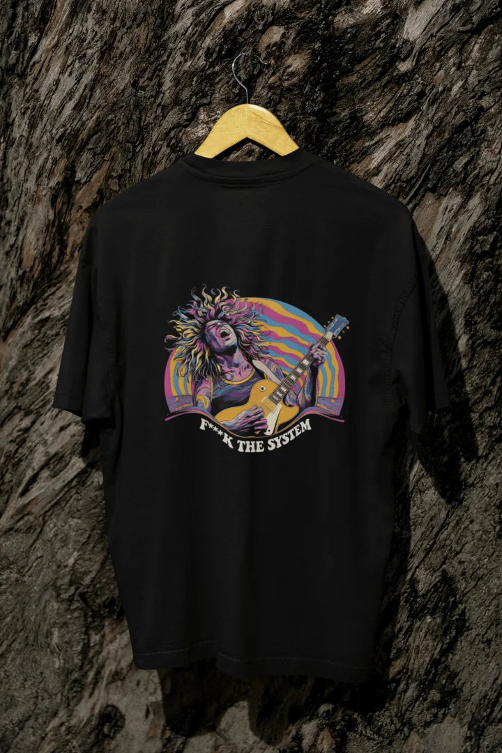 A black back printed oversized t-shirt with a vibrant psychedelic graphic of a man playing an electric guitar, surrounded by wavy pastel shapes. Bold text below reads “F**K THE SYSTEM.”