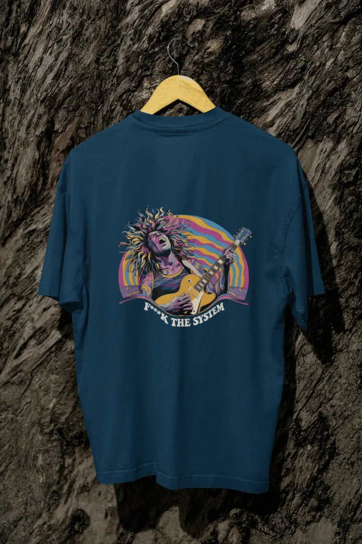 A navy blue back printed oversized t-shirt with a vibrant psychedelic graphic of a man playing an electric guitar, surrounded by wavy pastel shapes. Bold text below reads “F**K THE SYSTEM.”