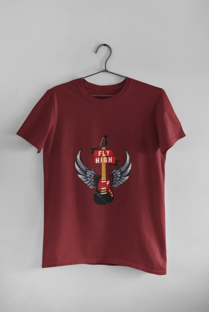A maroon T-shirt hanging against a light grey background. The T-shirt consists of the design of a guitar having wings. There’s a text saying Fly High.