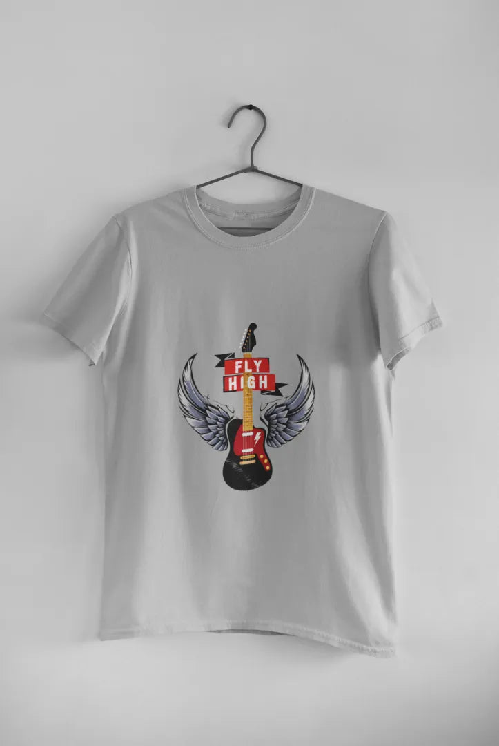 A grey T-shirt hanging against a light grey background. The T-shirt consists of the design of a guitar having wings. There’s a text saying Fly High.