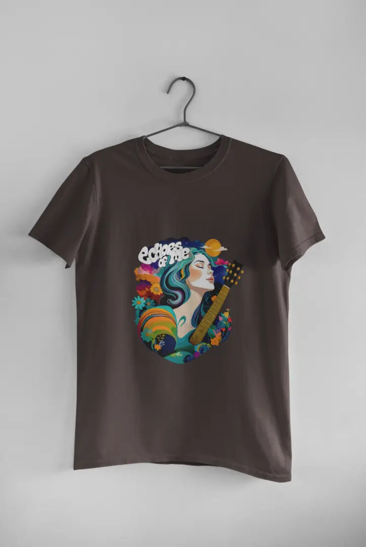 A charcoal grey T-shirt hanging against a grey background consisting of a psychedelic design of a girl holding a guitar. There’s a text saying echoes of me.