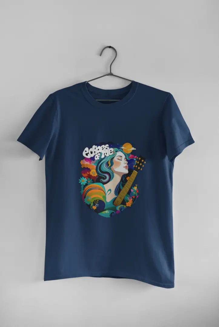 A navy blue T-shirt hanging against a grey background consisting of a psychedelic design of a girl holding a guitar. There’s a text saying echoes of me.