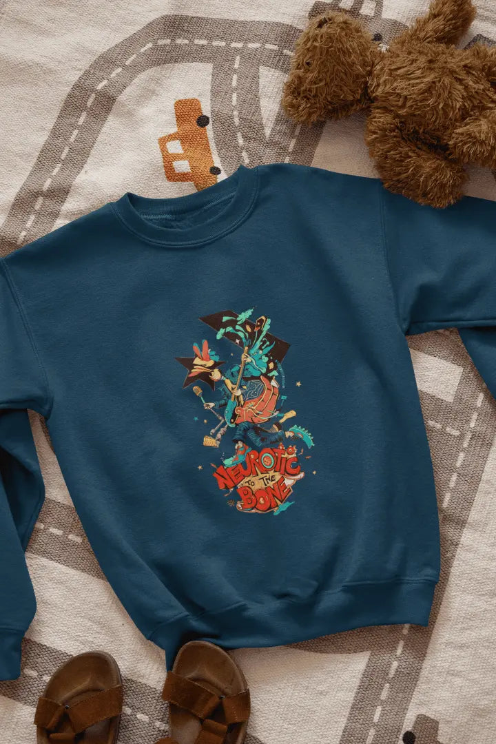A navy blue sweatshirt with a printed design lying on the floor. The design contains of a funky character with an instrument and a microphone in his hand. There’s a text saying “Neurotic to the bone”.