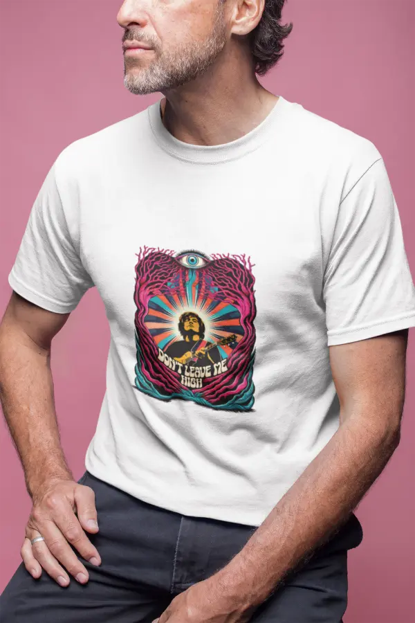 A man wearing a white t-shirt with a psychedelic design printed on the front. The design contains a man playing guitar with his eyes closed. The overall design is psychedelic with an eye at the top and a text saying Don't leave me high at the bottom of the design.