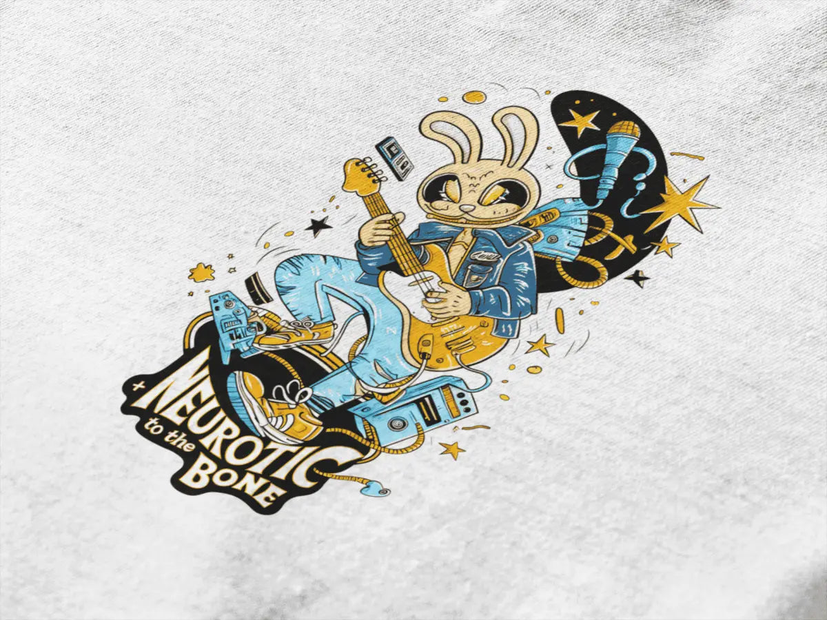 Close up of a t-shirt with a design printed at the back. The design consists of a character playing a guitar. The overall design is funky. There's a text saying Neurotic to the Bone at the bottom of the design.