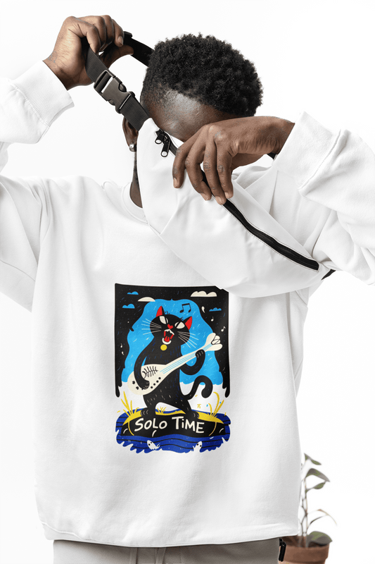 A man wearing a white sweatshirt with a design printed on the front. The design contains a cat holding a fish bone like a guitar and appearing to play it aggressively. There's a text saying Solo Time at the bottom of the design.