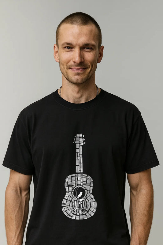 Man wearing a black t-shirt with a white guitar graphic on a gray background