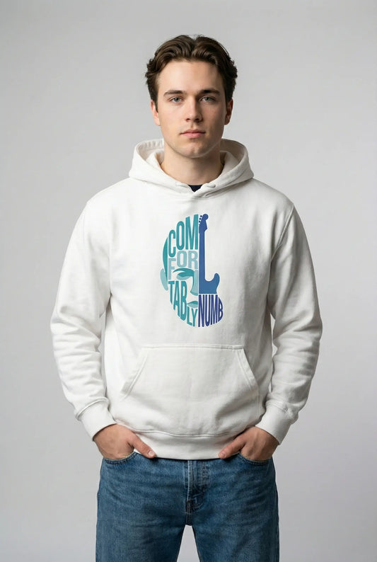 Person wearing a white hoodie with colorful text design on a plain background