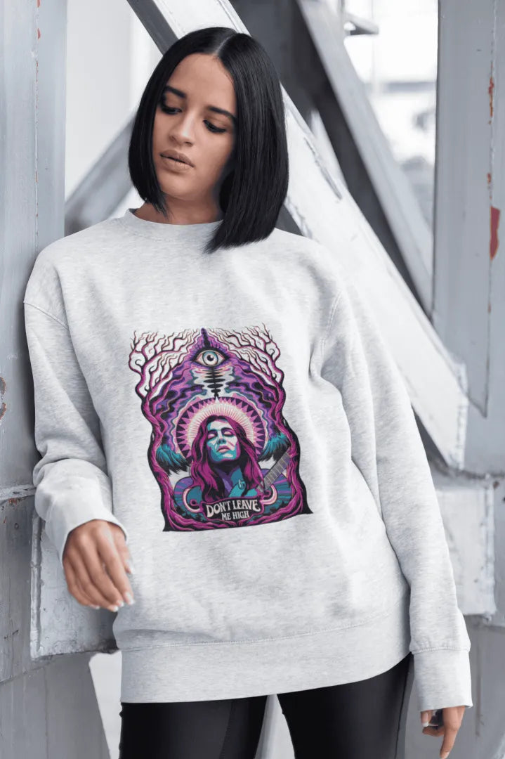 A white printed sweatshirt featuring a psychedelic graphic of a musician playing a guitar, surrounded by vibrant swirling colors. The design includes a large stylized eye and the text “DON’T LEAVE ME HIGH,” evoking a 1960s/1970s psychedelic art style. The composition is centered with harmonious lighting and a visually impactful atmosphere.