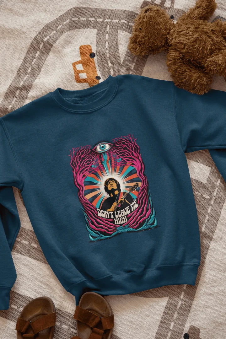 A navy blue sweatshirt with a graphic print. The graphic features a young, light-skinned man, depicted from the mid-section up. He is playing a guitar. The man is positioned within an abstract design of swirling, colorful patterns and stylized,  leaf-like forms in various shades of pink, purple, teal, orange, and yellow. A large, stylized eye is prominently featured in the design, situated above the man's head. The words "DON'T LEAVE ME HIGH" are printed below.
