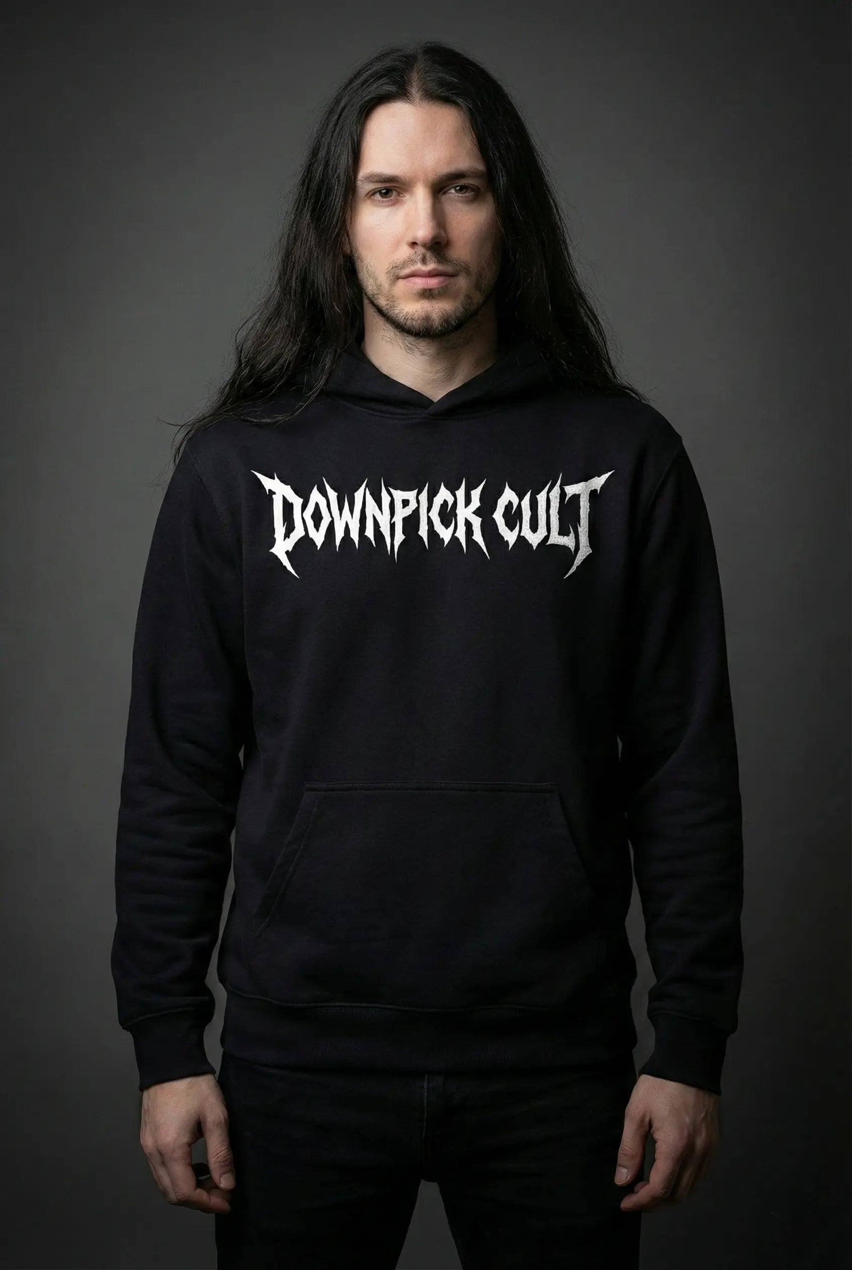 Person wearing a black hoodie with 'Downpick Cult' text on a dark background