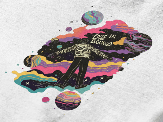 Design printed on a white T-shirt. The design consists of a man floating in space, there’s a text saying Lost in The sound