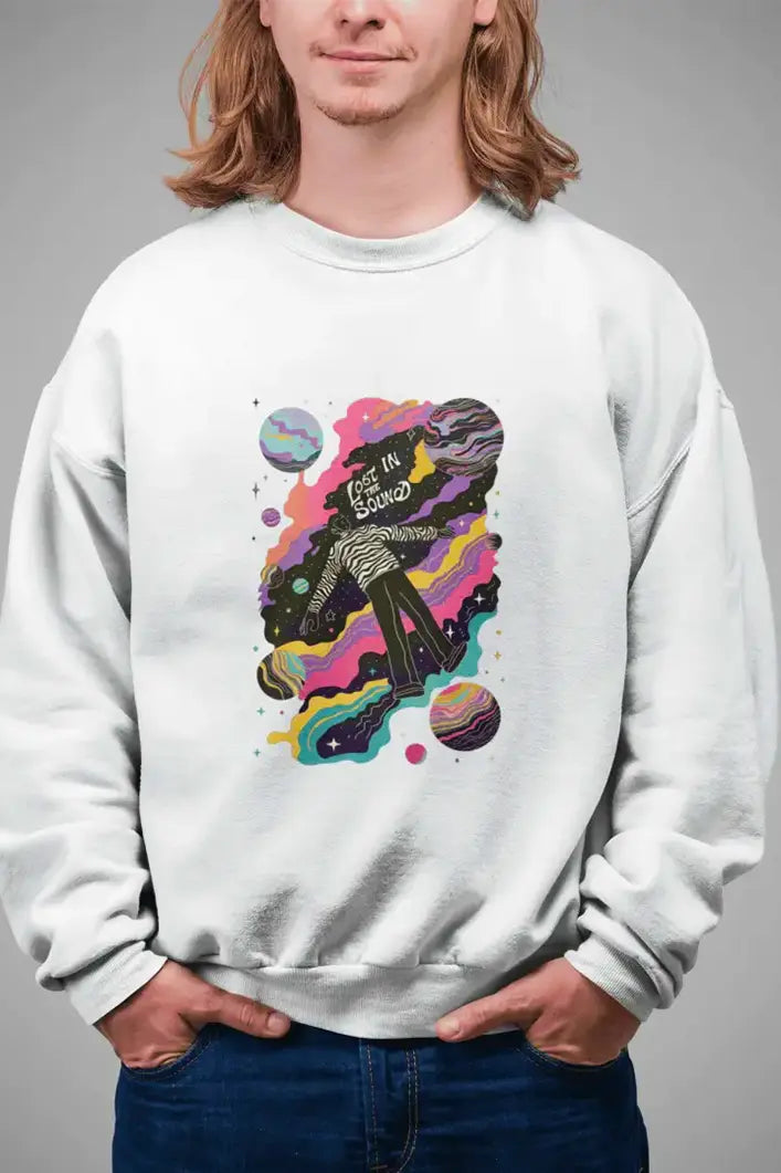 A long haired man wearing a printed white sweatshirt with the design of a man floating in space. There’s a text saying Lost in the Sound.
