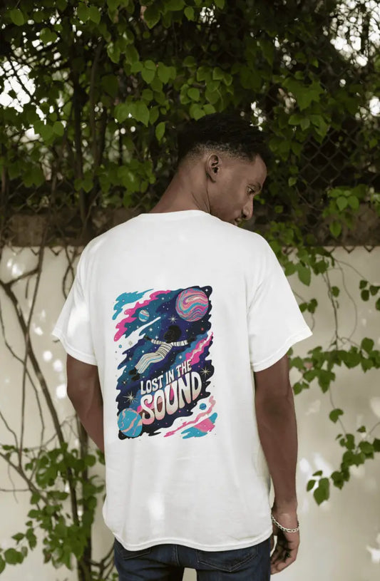 A man wearing a white oversized t-shirt with a back print. The print design contains a kid floating in space with planets and starts surrounding him. There is a text saying Lost In The Sound on the design.