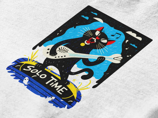 Close up of a design printed on a t-shirt. The design contains a cat holding a fish bone like a guitar and appears to play it aggressively. There's a text saying Solo Time at the bottom of the design.