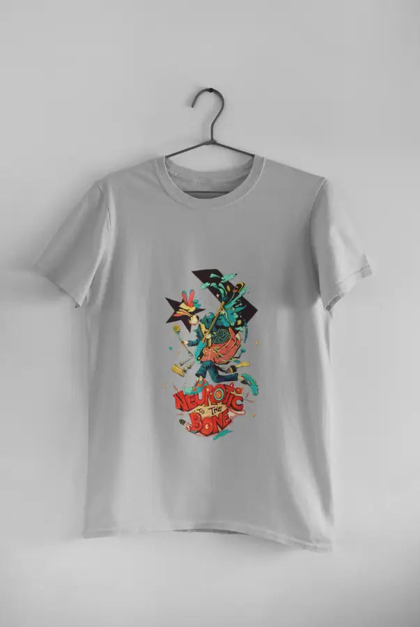 A grey printed t-shirt hanging against a light grey wall. The t-shirt design consists of a character with a microphone in his hand. There's a text saying Neurotic To the Bone at the bottom of the design.