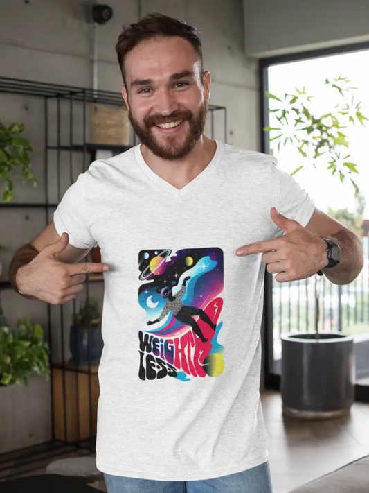 A smiling man wearing a white t-shirt with a design printed on the front. The design contains a woman who is floating in space with planets and stars around her. There's a text saying Weightless at the bottom of the design.